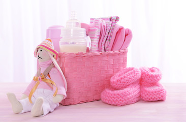 Baby accessories on table on light background