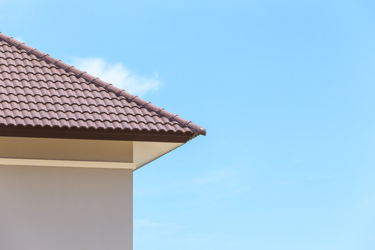roof under construction with stacks of roof tiles for home build