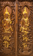 Fototapeta na wymiar Traditional Thai style church door, Buddhist art