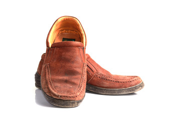 Brown leather men's shoes with wooden shoe stretchers on the sid