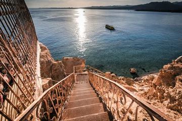 Fotobehang landscape with stairs to sea at sunset, Sharm El Sheikh, Egypt © sola_sola