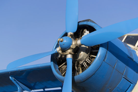Blue airplane propeller with four blades © Edelweiss086
