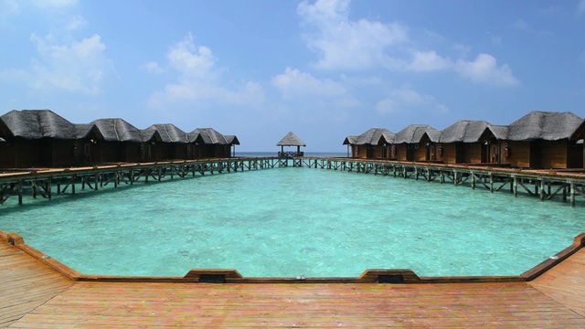 Over water bungalows with steps into amazing green lagoon