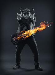 Rock musician in scary masks emotionally gesticulates hands.