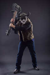 Rock musician in scary masks emotionally gesticulates