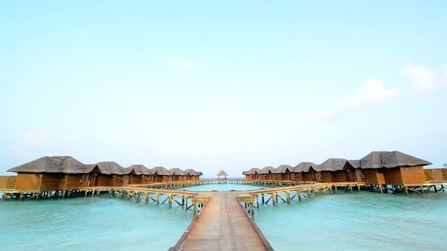 Over water bungalows with steps into amazing green lagoon