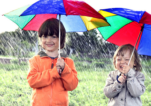 two brothers play in rain