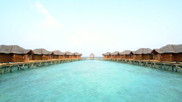 Over water bungalows with steps into amazing green lagoon