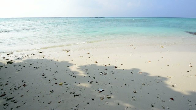 Sand beach and ocean wave, South Male Atoll. Maldives