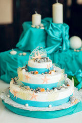 White  wedding cake decorated with seashells