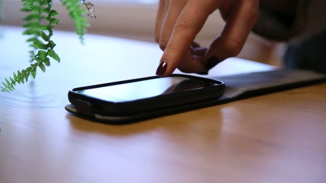 girl operating smartphone