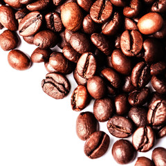 Roasted coffee beans isolated on a white background. Closeup, ma