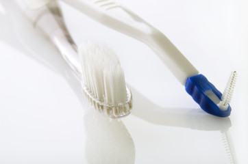 Fototapeta na wymiar toothbrush and ruff on white table