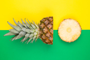 Tropical pineapples on green and yellow background