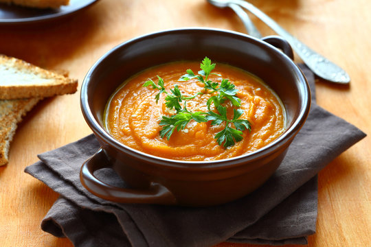  spicy pumpkin soup with parsley in bowl