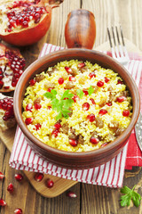 Couscous with pomegranate, raisins and spices