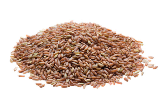 pile of brown rice isolated on white