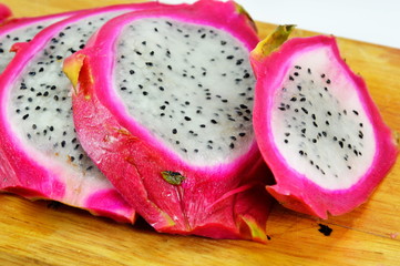 dragon fruit slice on chop block