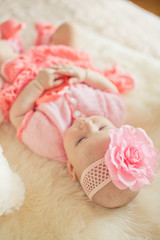 Little baby girl wearing pink knitting dres