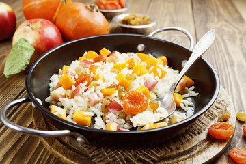 Sweet pilaf with pumpkin, apples and dried fruit