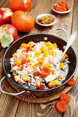 Sweet pilaf with pumpkin, apples and dried fruit