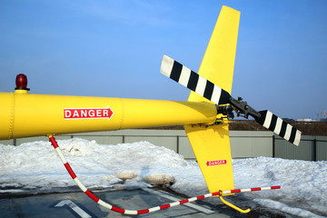 tail of a yellow helicopter