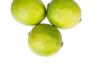 Fresh limes isolated on white background