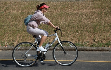 Fototapeta premium woman rides a bicycle