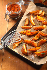 Fried Potato Slices on Tray with Slotted Ladle
