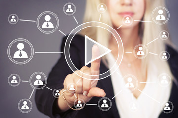 Businesswoman hand press web play button.