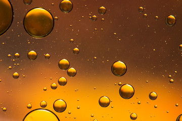 Oil and water abstract in gold and brown