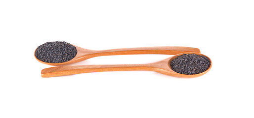 Sesame seeds on wooden spoon. isolated on a white background