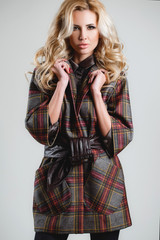 The model comes on the catwalk during a fashion show.