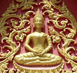 Fototapeta premium Thai art gold buddha on the door in Temple