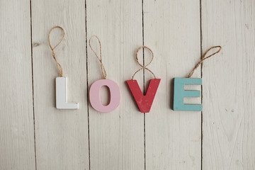 Love vintage letters on wooden background
