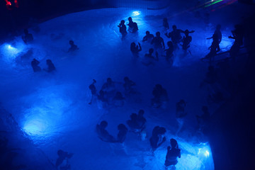 Night party in thermal bath in Budapest, Hungary.