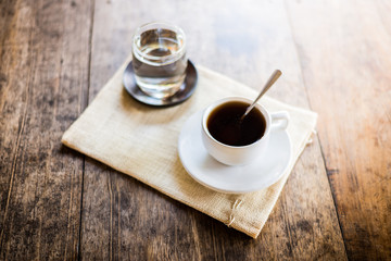 Cup of coffee on a wooden table