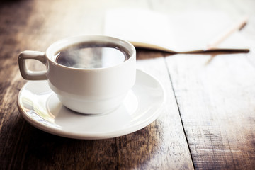Cup of coffee on a wooden table