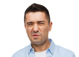 man wrying of unpleasant smell