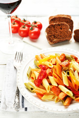 Pasta salad with pepper, carrot and tomatoes