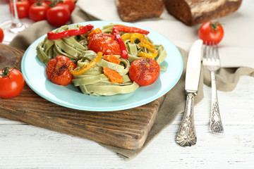 Tasty pasta with pepper, carrot and tomatoes