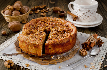 Piece of apple pie with walnut and sugar glaze