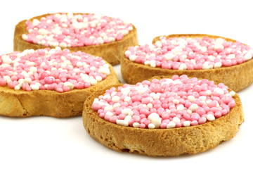 rusks with white and pink anise seed sprinkles