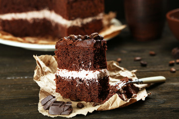 Delicious chocolate cake on table close-up