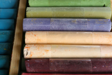 Colorful chalk pastels in box close up