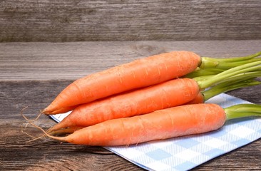 Carrots on wooden table