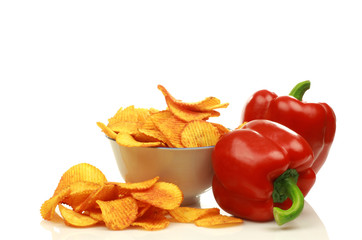 two red bell peppers and paprika chips in a bowl