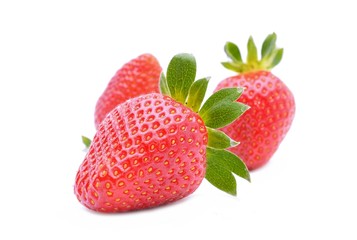 strawberries close up on white background
