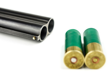 Barrel shotgun and cartridges on a white background