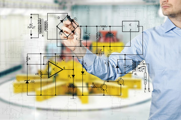 electrical engineer draws a diagram of a circuit. power plant in